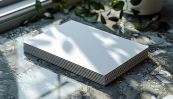 A stack of white paper is on a table photo