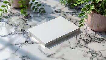 A white card with a green leaf on it sits on a marble countertop photo