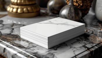 A stack of white papers is on a marble countertop photo