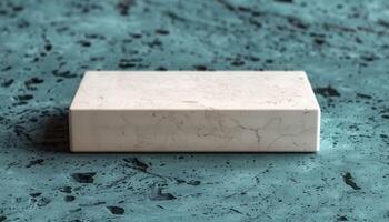 A white box sits on a blue surface photo
