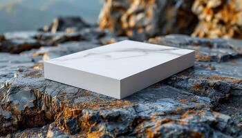 A white box is on a rock photo