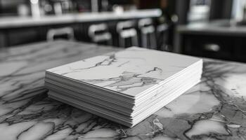 A stack of white papers with a black and white marble pattern photo