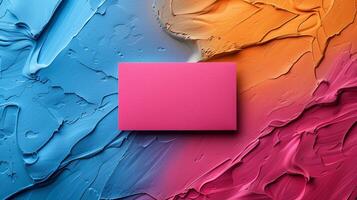 A painting of a pink square on a blue and orange background photo