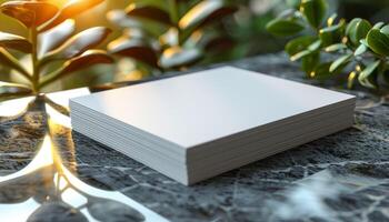 A stack of white papers sits on a marble countertop photo
