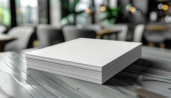 A stack of white papers sits on a table in a restaurant photo