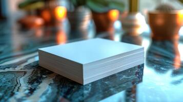 A stack of white papers is on a table photo