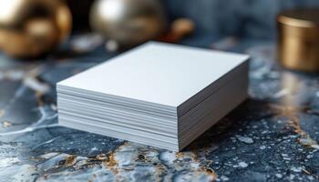 A stack of white papers is on a marble countertop photo