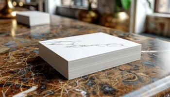 A white box with a marble design sits on a brown table photo