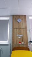 Empty wheeled bed for women in labor. Big light delivery ward in up-to-date maternity clinic. View from below. Vertical video