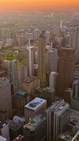 Remarkable scenery of Chicago in the rays of setting sun. Skyscrapers at downtown. Lake Michigan at backdrop. Vertical video