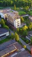 Factory With Broken Windows. Aerial view of an old factory ruin and broken windows Vertical video