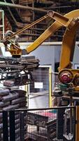 Sawmill processing on machines. Production line of the sawmill factory. Vertical video