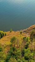 Landscape of mountain view. Aerial drone view of lake in mountain. Vertical video