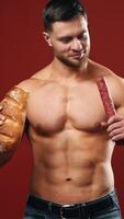 Difficult choice between sport and junk food. Unhealthy eating diet on dark red background. Vertical video
