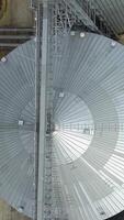 Container for storage of crop. Big group of grain dryers complex for drying grain Vertical video