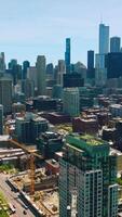 Scenic panorama of big modern city. Circle movement around the diverse architecture of Chicago city. Vertical video