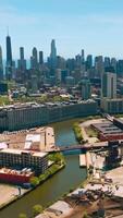 Beautiful scenery of Chicago skyscrapers against Lake Michigan. Usual and plain buildings at the backdrop of modern architecture. Vertical video