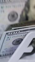 US dollar banknote in counting machine. Automatic mechanism for bank financial operations. Vertical video