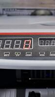 Money counting equipment for paper money calculation. US national paper currency. Automatic mechanism for bank financial operations. Vertical video