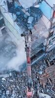 Demolishing machinery breaks the floors and walls of the ruin. Debris falling down with heavy dusty clouds. Rising over the ruins and debris. Vertical video