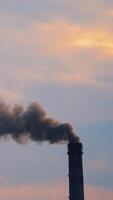 Air pollution in smoke from pipes of metallurgy plant. Massive air pollution filling the sky creating a toxic environment affecting life. Ecological disaster. Vertical video