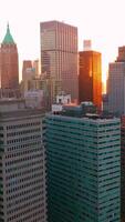 Dense architecture of fantastic New York. Drone shot of the buildings and skyscrapers of Manhattan Island. Vertical video