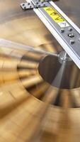 Centrifuge device working. Honey frames being rotated inside the apparatus for extracting honey harvest. Close up. Vertical video