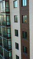 Newly constructed building. Aerial view of building construction site district Vertical video