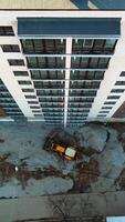 Building under construction. Aerial view of tall buildings under construction Vertical video