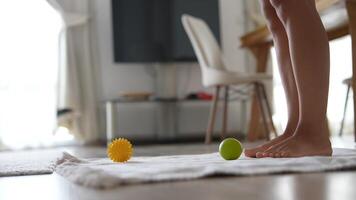A set of colorful massage balls arranged on a soft mat for enhanced relaxation and comfort video