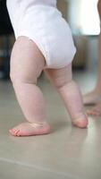 A Cute Baby Moment Taking Its First Steps Indoors While Exploring Their Surroundings, video