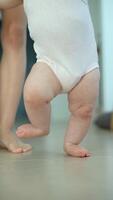 A Baby Taking Their Very First Steps in a Comfortable and Modern Home Setting Environment video