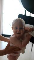 A Happy Baby is Joyfully Smiling and Playing Happily Indoors with Joyful Delight and Cheer video