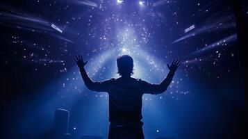 Performer reaching out to audience under bokeh lights image. Stage lighting creating magical atmosphere photography scene wallpaper. Showmanship artistry concept photorealistic photo