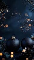Christmas decoration with two blue ornaments sparkling lights and pine cones photo