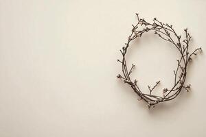 Minimalistic wreath lying on neutral background for holidays photo