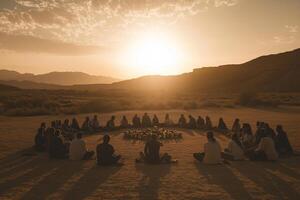 Large group meditating in a circle at sunrise in the desert Yom Kippur and Sukkot photo