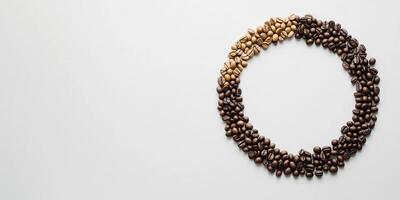 Coffee beans arranged in circle forming gradient on white background photo