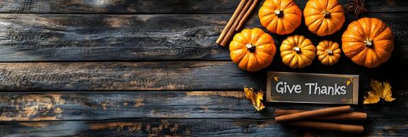 Thanksgiving Pumpkins Cinnamon Sticks Give Thanks Sign Rustic Wood Background photo