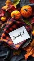 Autumn Table Setting with Pumpkins and Plaid Napkin with Grateful Note Card photo