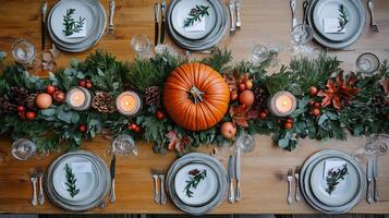 Rustic Thanksgiving Table Setting with Pumpkin Greenery and Candles photo