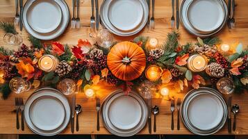 Rustic Thanksgiving Table Setting with Pumpkin Candles and Fall Decor photo