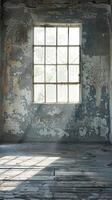 An empty room with a window and wood floor photo