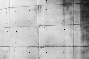 Curved Concrete Wall with Grid Pattern and Holes photo