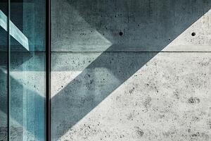 Concrete Wall with Glass Panel and Diagonal Shadow photo