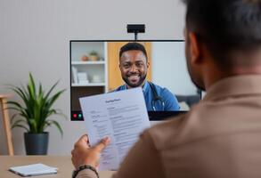 Patient reviewing medical documents during a virtual consultation with a doctor. photo