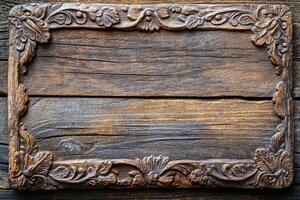Ornate Carved Wooden Frame with Weathered Wood Background photo