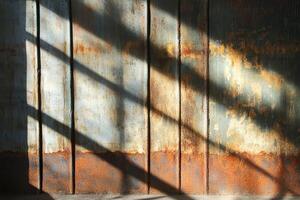 Rusty Metal Wall With Diagonal Shadows photo