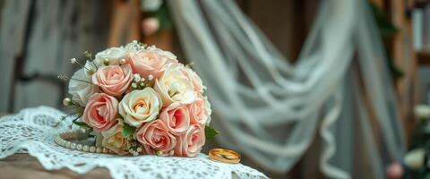 Wedding Bouquet with Gold Ring and Pearl Necklace on Lace Fabric photo