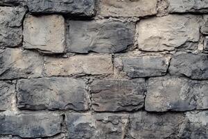 Close-up of a weathered stone wall with irregular shapes and textures photo